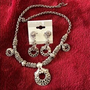 Metal jewelry with matching earrings